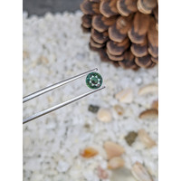 0.91 Ct. Bluish Green Sapphire from Madagascar Life Style