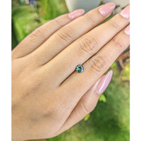 0.68 Ct. Bluish Green Sapphire from Madagascar Life Style