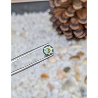 0.72 Ct. Yellowish Green Sapphire from Madagascar Life Style