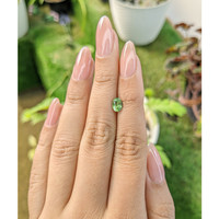 0.98 Ct. Yellowish Green Sapphire from Madagascar Life Style