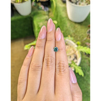 0.72 Ct. Bluish Green Sapphire from Madagascar Life Style