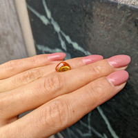 4.17 Ct. Orangish Yellow Cabochon Sapphire from Ceylon (Sri Lanka) Life Style