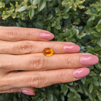 4.17 Ct. Orangish Yellow Cabochon Sapphire from Ceylon (Sri Lanka) Life Style