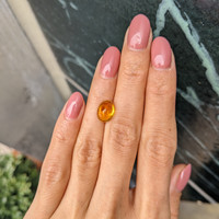 4.17 Ct. Orangish Yellow Cabochon Sapphire from Ceylon (Sri Lanka) Life Style