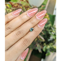 0.71 Ct. Bluish Green Sapphire from Madagascar Life Style