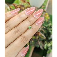 0.65 Ct. Yellowish Green Sapphire from Madagascar Life Style