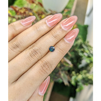 0.75 Ct. Greenish Blue Sapphire from Madagascar Life Style