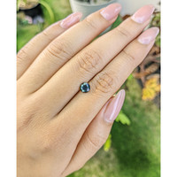 0.79 Ct. Greenish Blue Sapphire from Madagascar Life Style