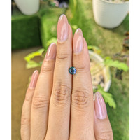 0.79 Ct. Greenish Blue Sapphire from Madagascar Life Style
