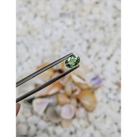 0.72 Ct. Bluish Green Sapphire from Madagascar Life Style