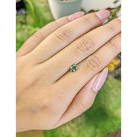 0.72 Ct. Bluish Green Sapphire from Madagascar Life Style