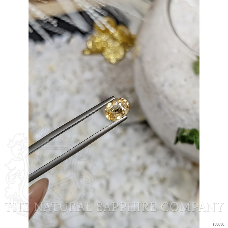 0.94 Ct. Orangish Yellow Sapphire from Ceylon (Sri Lanka)