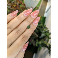 0.84 Ct. Yellowish Green Sapphire from Madagascar Life Style
