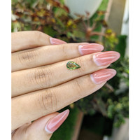 1.03 Ct. Yellowish Green Sapphire from Madagascar Life Style