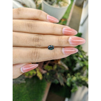 0.86 Ct. Bluish Green Sapphire from Madagascar Life Style