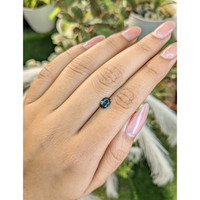 0.79 Ct. Greenish Blue Sapphire from Madagascar Life Style