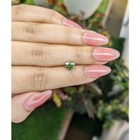 0.88 Ct. Yellowish Green Sapphire from Madagascar Life Style