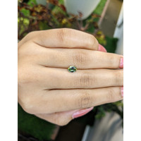 0.82 Ct. Yellowish Green Sapphire from Madagascar Life Style