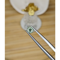 0.66 Ct. Yellowish Green Sapphire from Madagascar Life Style