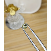 0.62 Ct. Greenish Yellow Sapphire from Madagascar Life Style