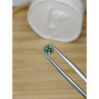 0.74 Ct. Yellowish Green Sapphire from Madagascar Life Style