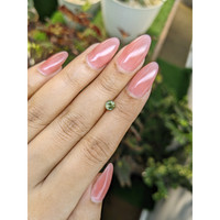 0.58 Ct. Yellowish Green Sapphire from Madagascar Life Style