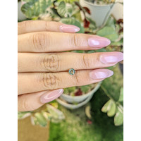 0.64 Ct. Green Sapphire from Madagascar Life Style