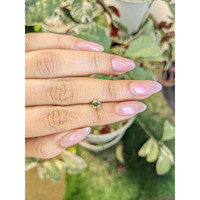 0.64 Ct. Greenish Yellow Sapphire from Madagascar Life Style