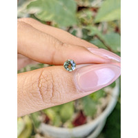 0.88 Ct. Yellowish Green Sapphire from Madagascar Life Style