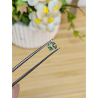 0.88 Ct. Yellowish Green Sapphire from Madagascar Life Style