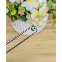 0.69 Ct. Yellowish Green Sapphire from Madagascar Life Style