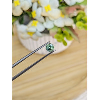0.67 Ct. Bluish Green Sapphire from Madagascar Life Style