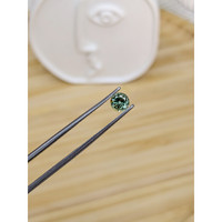 0.63 Ct. Bluish Green Sapphire from Madagascar Life Style