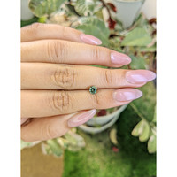 0.63 Ct. Bluish Green Sapphire from Madagascar Life Style