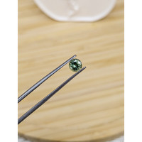 0.69 Ct. Yellowish Green Sapphire from Madagascar Life Style