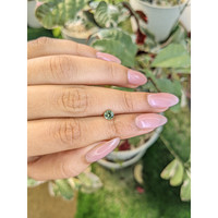 0.66 Ct. Green Sapphire from Madagascar Life Style