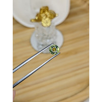 0.87 Ct. Yellowish Green Sapphire from Madagascar Life Style