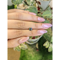 0.77 Ct. Bluish Green Sapphire from Madagascar Life Style