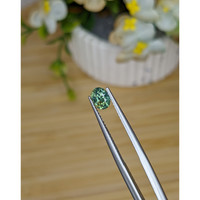 0.88 Ct. Yellowish Green Sapphire from Madagascar Life Style