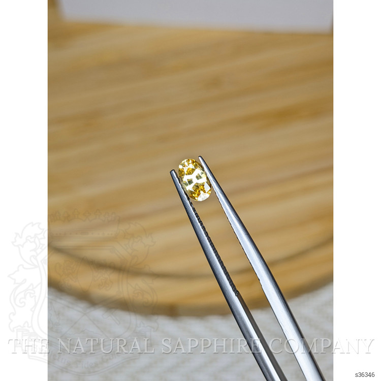 0.52 Ct. Orangish Yellow Sapphire from Ceylon (Sri Lanka)