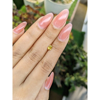 0.39 Ct. Orangish Yellow Sapphire from Ceylon (Sri Lanka) Life Style