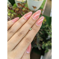 0.28 Ct. Greenish Yellow Sapphire from Ceylon (Sri Lanka) Life Style