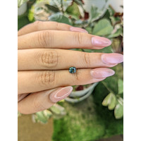 0.97 Ct. Bluish Green Sapphire from Madagascar Life Style