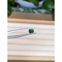 0.90 Ct. Bluish Green Sapphire from Madagascar Life Style