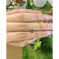 0.84 Ct. Brownish Green Sapphire from Madagascar Life Style