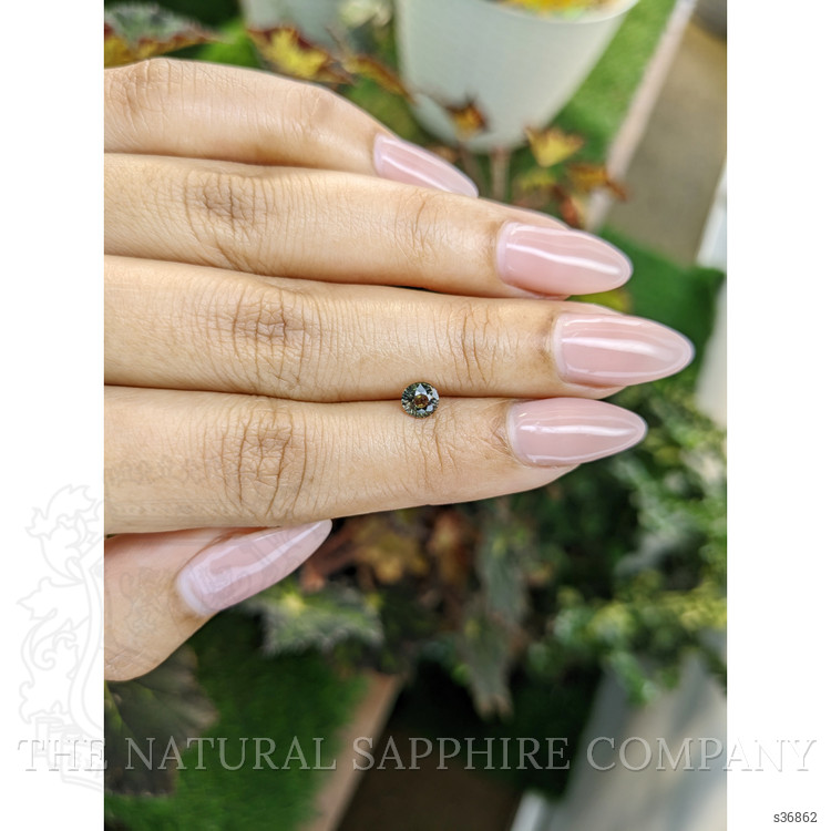 0.61 Ct. Brownish Green Sapphire from Madagascar