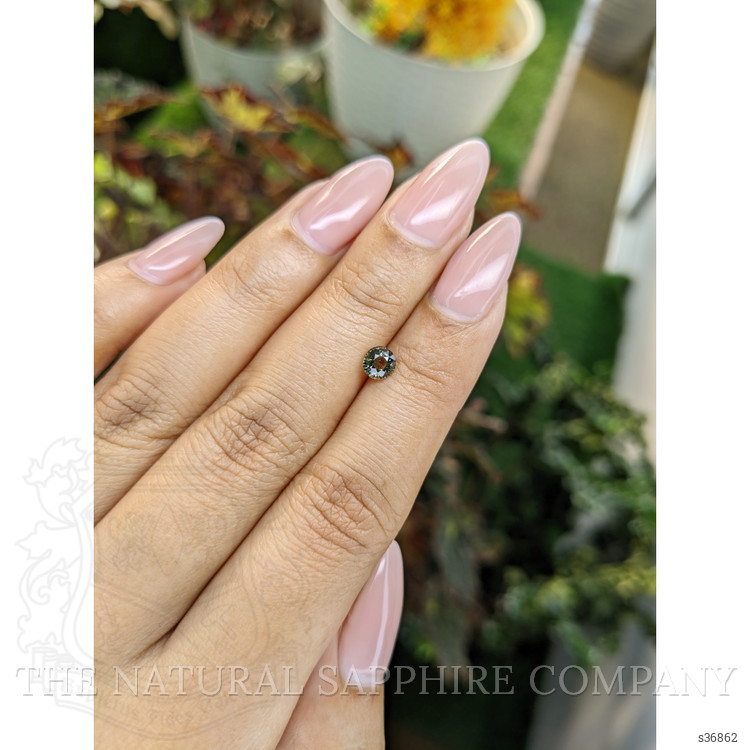 0.61 Ct. Brownish Green Sapphire from Madagascar