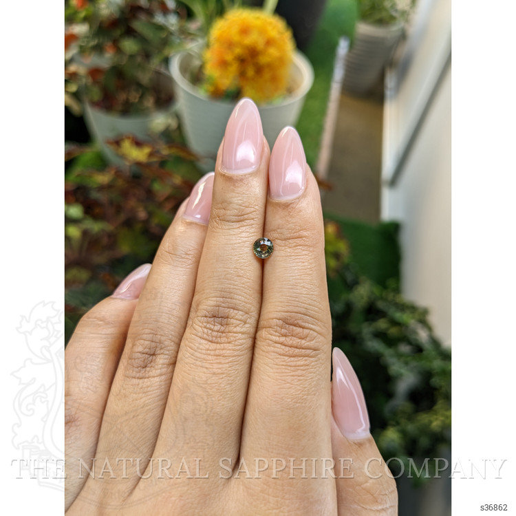 0.61 Ct. Brownish Green Sapphire from Madagascar