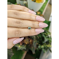 0.67 Ct. Green Sapphire from Madagascar Life Style