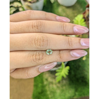 0.80 Ct. Yellowish Green Sapphire from Madagascar Life Style